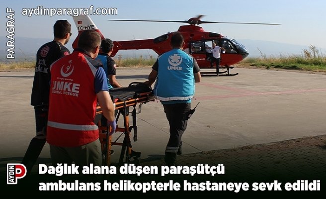 Dağlık alana düşen paraşütçü ambulans helikopterle hastaneye sevk edildi