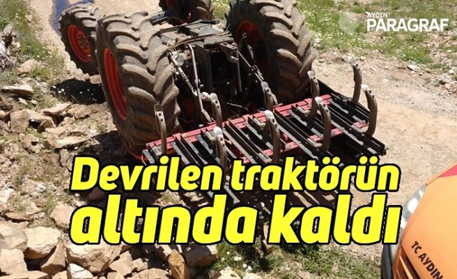 Devrilen traktörün altında kaldı