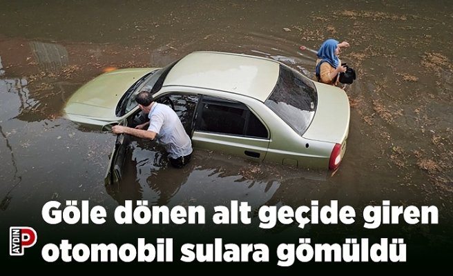 Göle dönen alt geçide giren otomobil sulara gömüldü