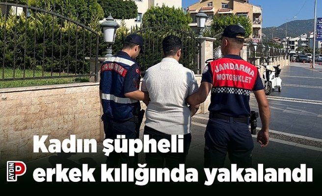 Kadın şüpheli erkek kılığında yakalandı