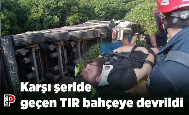 Karşı şeride geçen TIR bahçeye devrildi