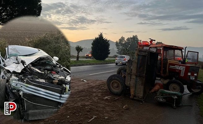 Otomobil kum yüklü traktöre çarptı